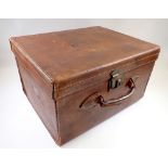 A Victorian leather travelling case with key