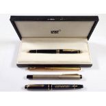 A Mont Blanc ballpoint pen, boxed and three various fountain pens including a gold plated Parker