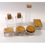 A silver and enamel mounted glass set of Art Deco gentleman's toiletry bottles and jars,