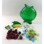 A collection of coloured glass items including Murano sweets, glass cherries, fish jug etc.