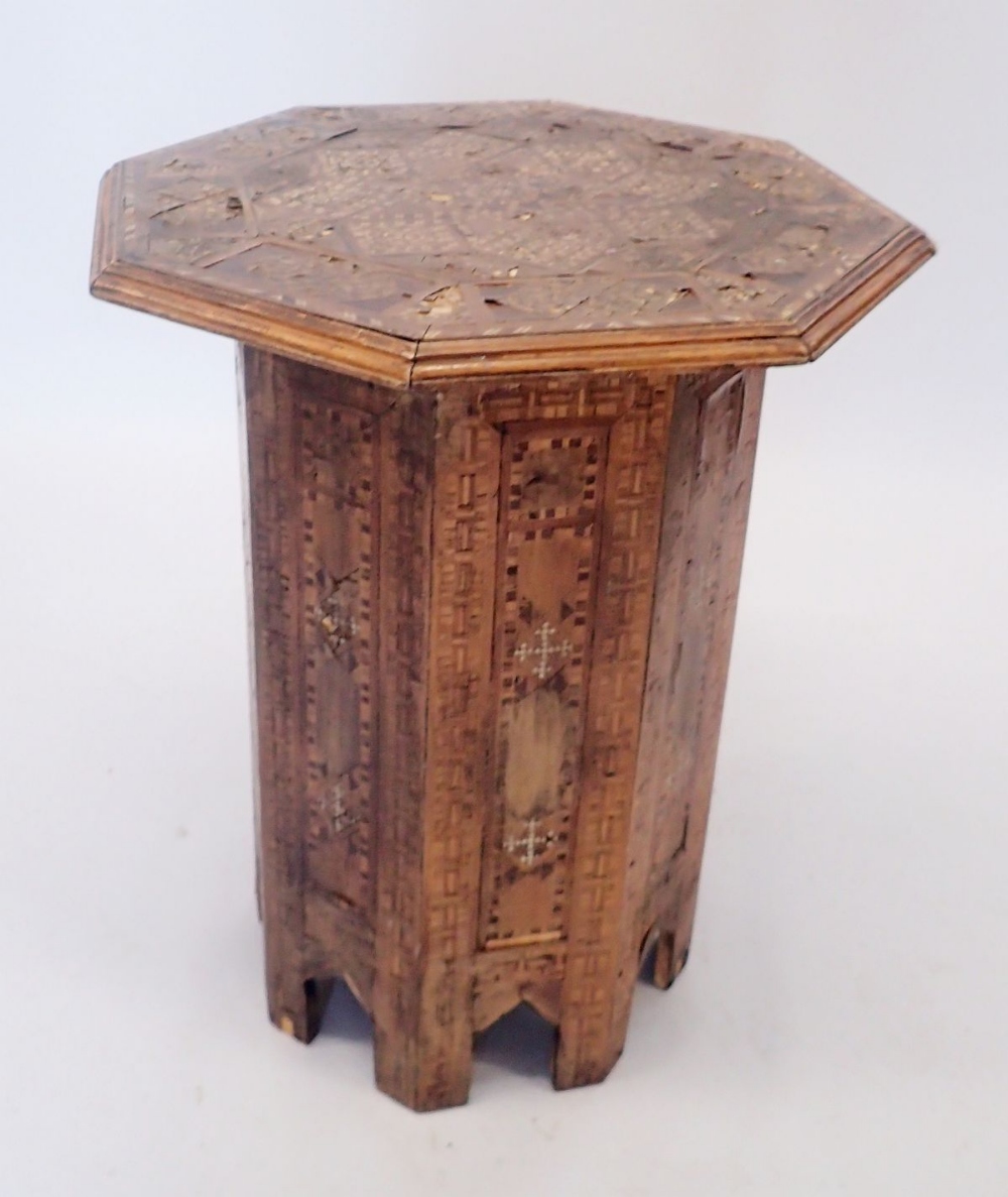 A Moroccan octagonal inlaid occasional table, 48cm diameter