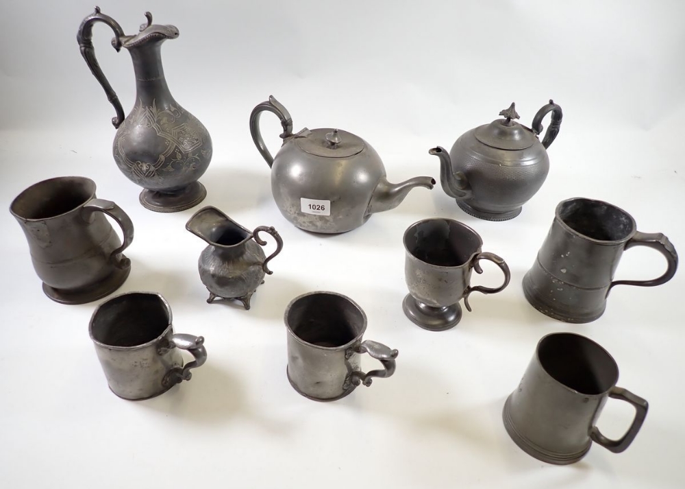 A group of antique pewter including mugs and tankards