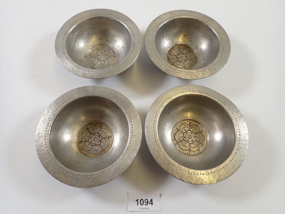 A set of four unusual Tudric pewter small dishes with Tudor Rose to base, made for Liberty, No