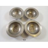 A set of four unusual Tudric pewter small dishes with Tudor Rose to base, made for Liberty, No