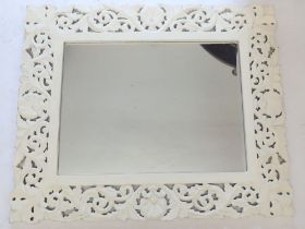 A white painted foliate framed modern mirror, 68 x 74cm