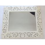 A white painted foliate framed modern mirror, 68 x 74cm