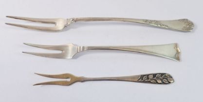 Two continental silver pickle forks and a Russian one, 74g