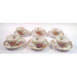 A set of six Dresden floral painted tea cups and saucers