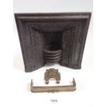 A 19th century salesman's miniature cast iron fireplace with brass fire grate and fender, 20.5cm