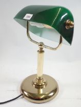 A brass desk lamp with green shade, 35cm tall