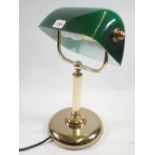 A brass desk lamp with green shade, 35cm tall