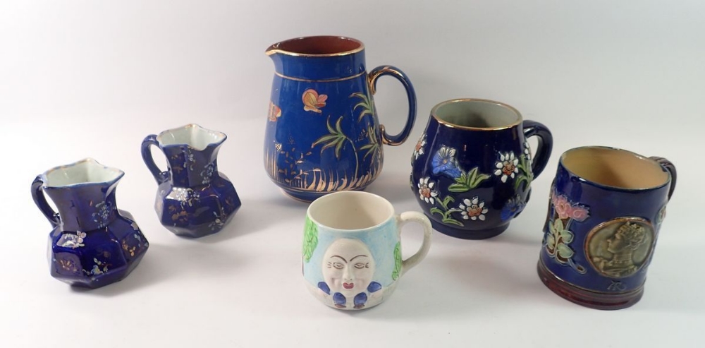 An 'Original King' mug 11cm, Deans Pottery jug, Humpty Dumpty mug, two Victorian jugs and a