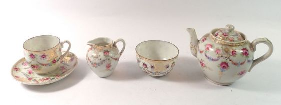 A floral painted bachelors teapot, cup and saucer, jug and sugar