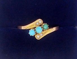 A 9 carat gold ring crossover set three turquoise and seed pearls, 1.2g, size N