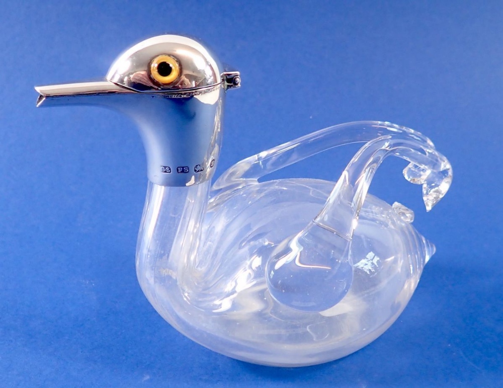 A novelty glass small decanter in the form a duck with silver mounts, Birmingham 1892, by Saunders &