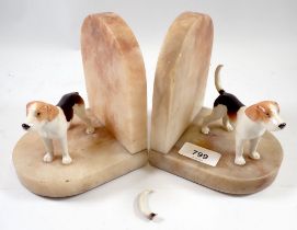 A pair of marble bookends with Beswick fox hounds (one tail a/f) 15cm tall