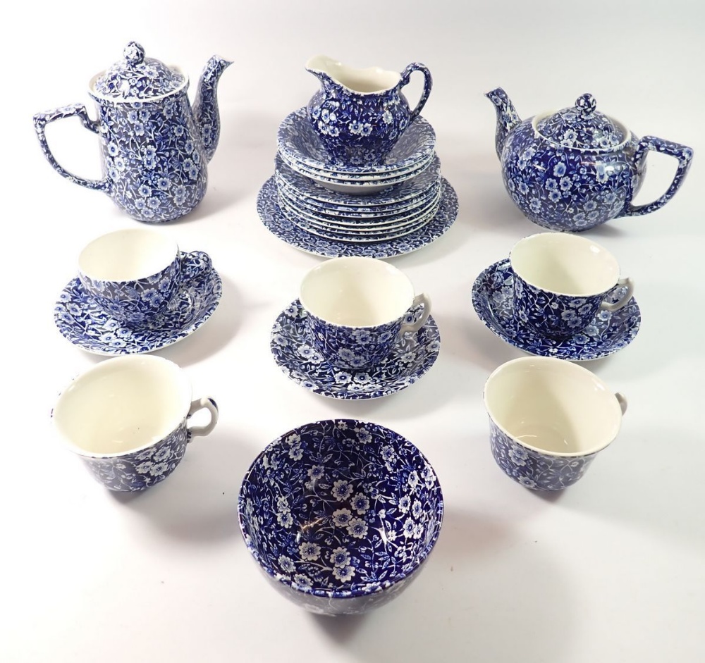 A Burleigh 'Calico' blue and white tea service comprising teapot, coffee pot, five cups, three