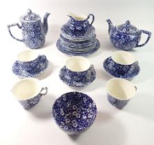 A Burleigh 'Calico' blue and white tea service comprising teapot, coffee pot, five cups, three