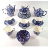 A Burleigh 'Calico' blue and white tea service comprising teapot, coffee pot, five cups, three