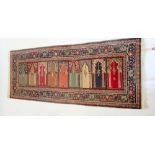 A Persian family prayer rug with five arched panels, 217 x 92cm