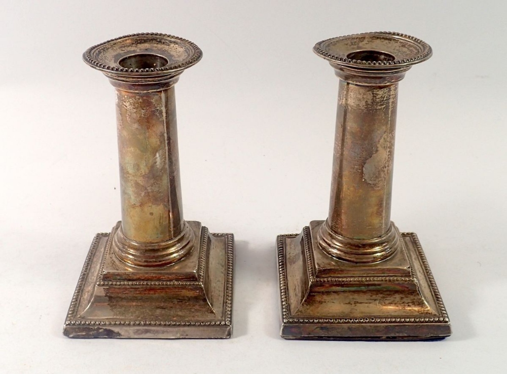 A pair of silver column candlesticks, 14cm tall, London 1895 and 1896 by Charles Boyton II