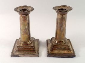 A pair of silver column candlesticks, 14cm tall, London 1895 and 1896 by Charles Boyton II