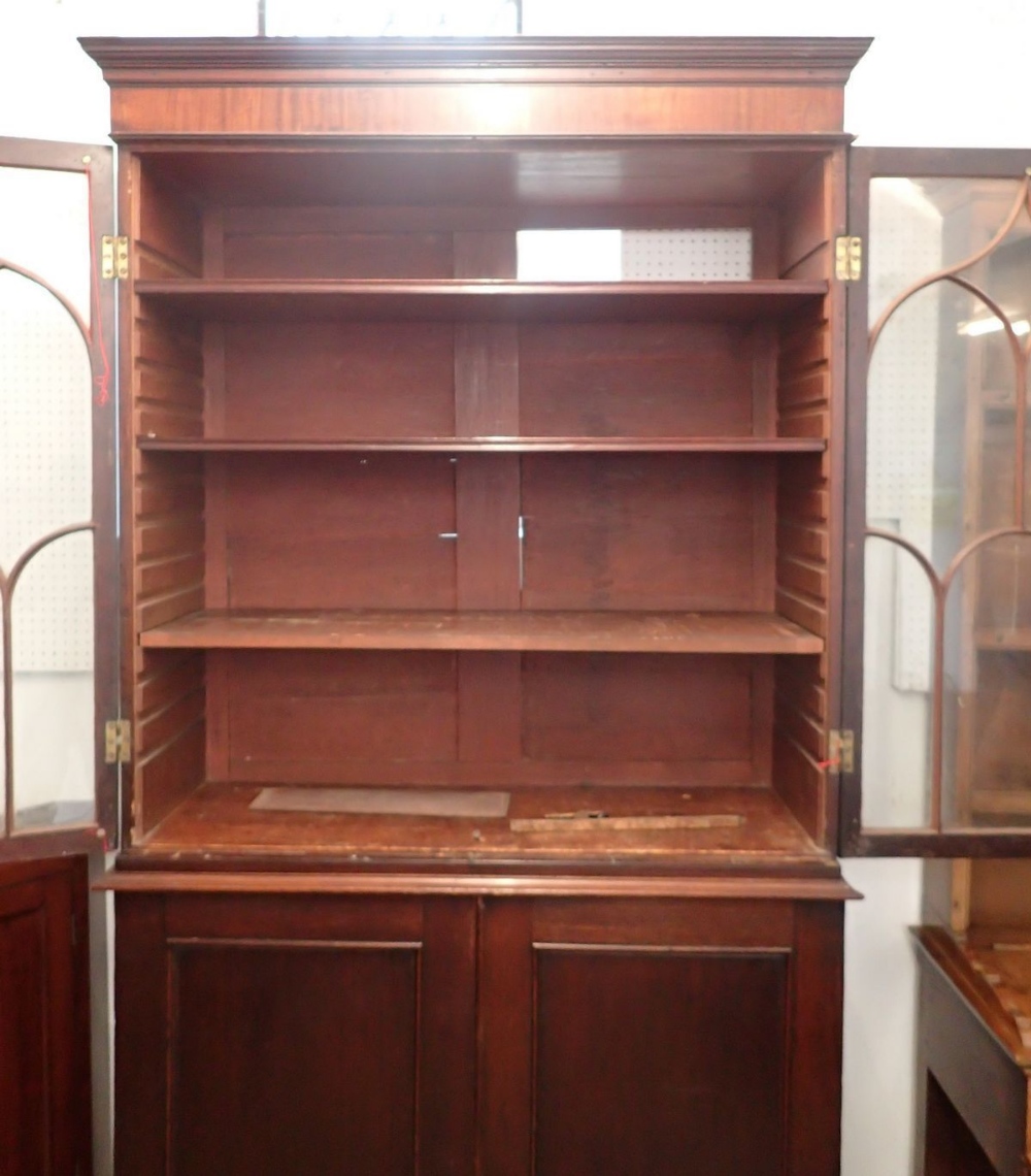 A Regency mahogany bookcase with two Gothic arch glazed doors over panelled cupboard, all on bracket - Image 2 of 2