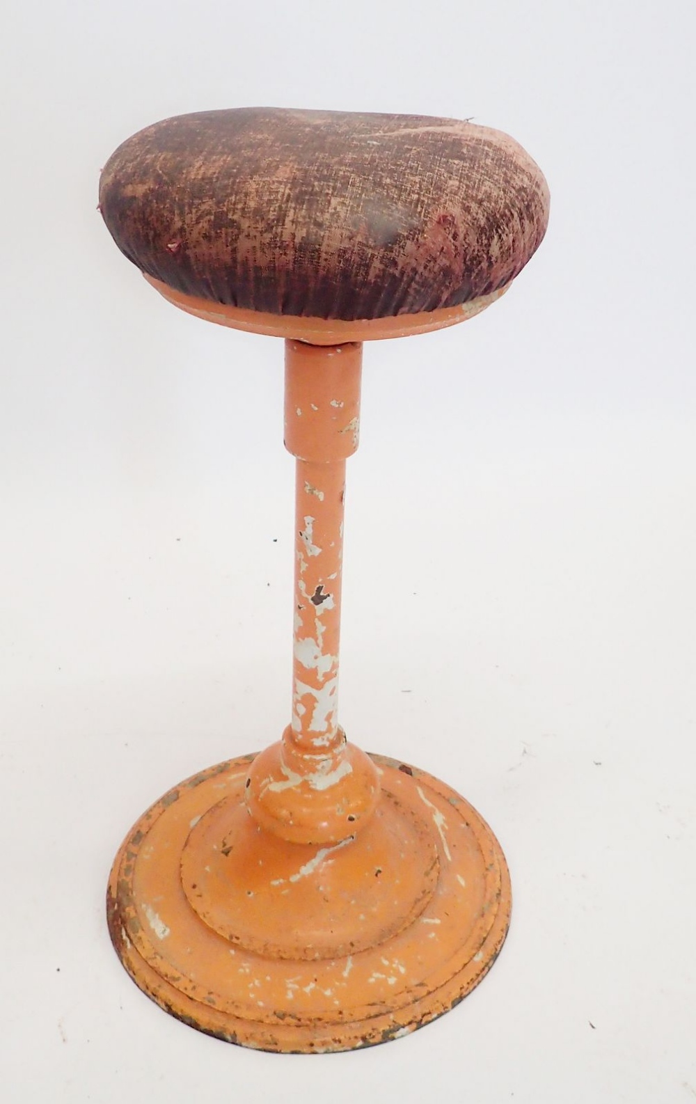 A French early 20th century dentists stool with swivel seat on metal stem with flexible ball joint