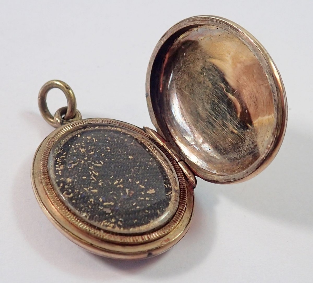 A Victorian gold oval locket with blue enamel vine inlay, unmarked but tested as 9ct gold 5.6g, 2. - Image 3 of 3