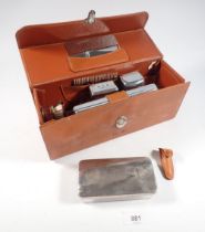 A gentleman's leather travelling toiletry set