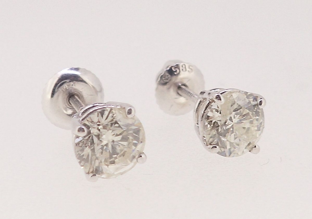 A pair of 14 carat white gold diamond stud earrings, approx. one carat each, for pierced ears with - Image 4 of 4