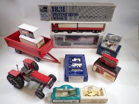 A Massey Ferguson deur FedMech tractor, 26cm long and trailer, two German model lorries and