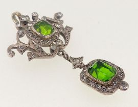 A Georgian white metal pendant set green and white paste, 4.6cm drop, 3cm wide