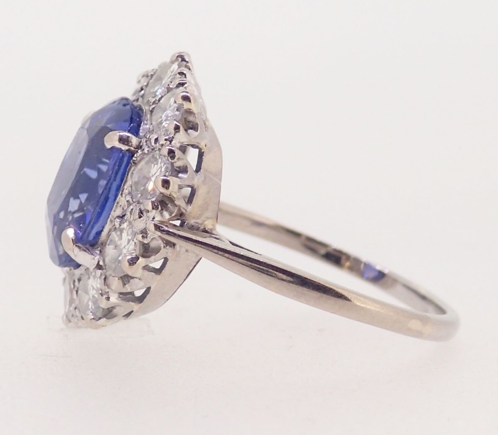 A fine Ceylon sapphire and diamond cluster ring, the sapphire 11mm x 8mm, ring size O, 4.8g - Image 7 of 7