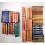 A box of literary books including some leather bindings and works by Ruskin, Thackeray etc.