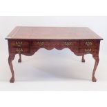 An early 20th century burr walnut large Queen Anne style library desk with five drawers (five