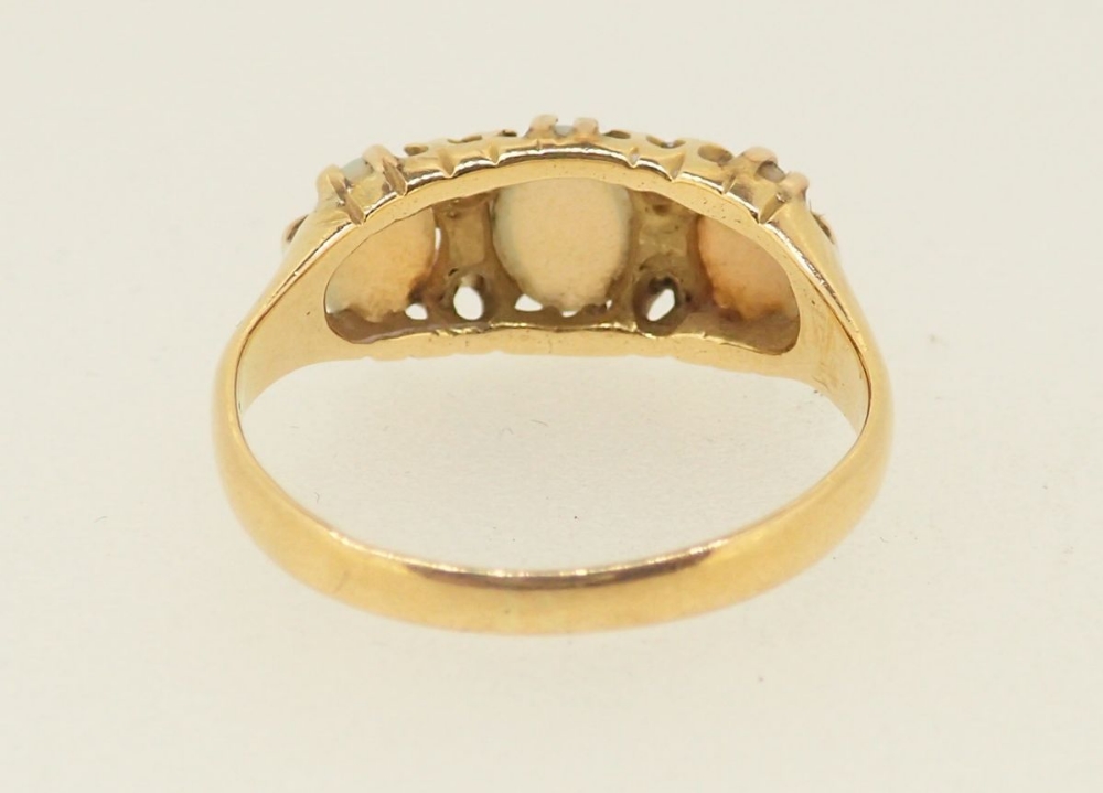 An 18 carat gold ring set three opals and four chip diamonds, size N, 3.1g - Image 4 of 4