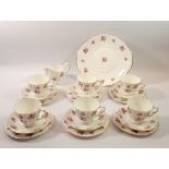 A Queen Anne floral printed vintage tea service No. 8670 comprising six cups and saucers, six tea