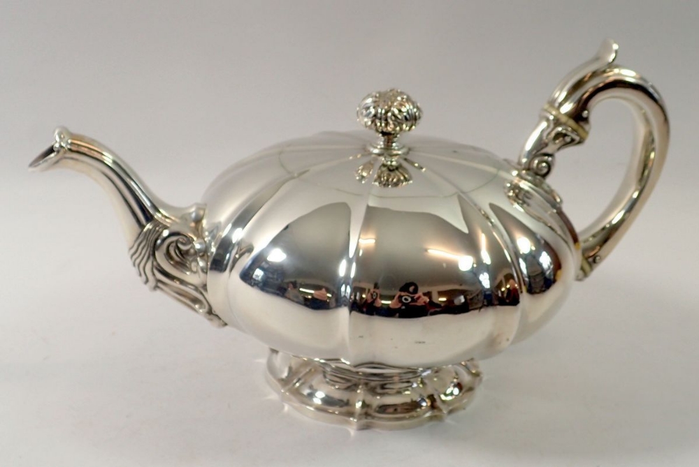 A Victorian silver melon form teapot with foliage and bird finial, Edinburgh 1828 by GP, 735g