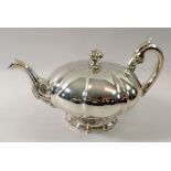 A Victorian silver melon form teapot with foliage and bird finial, Edinburgh 1828 by GP, 735g