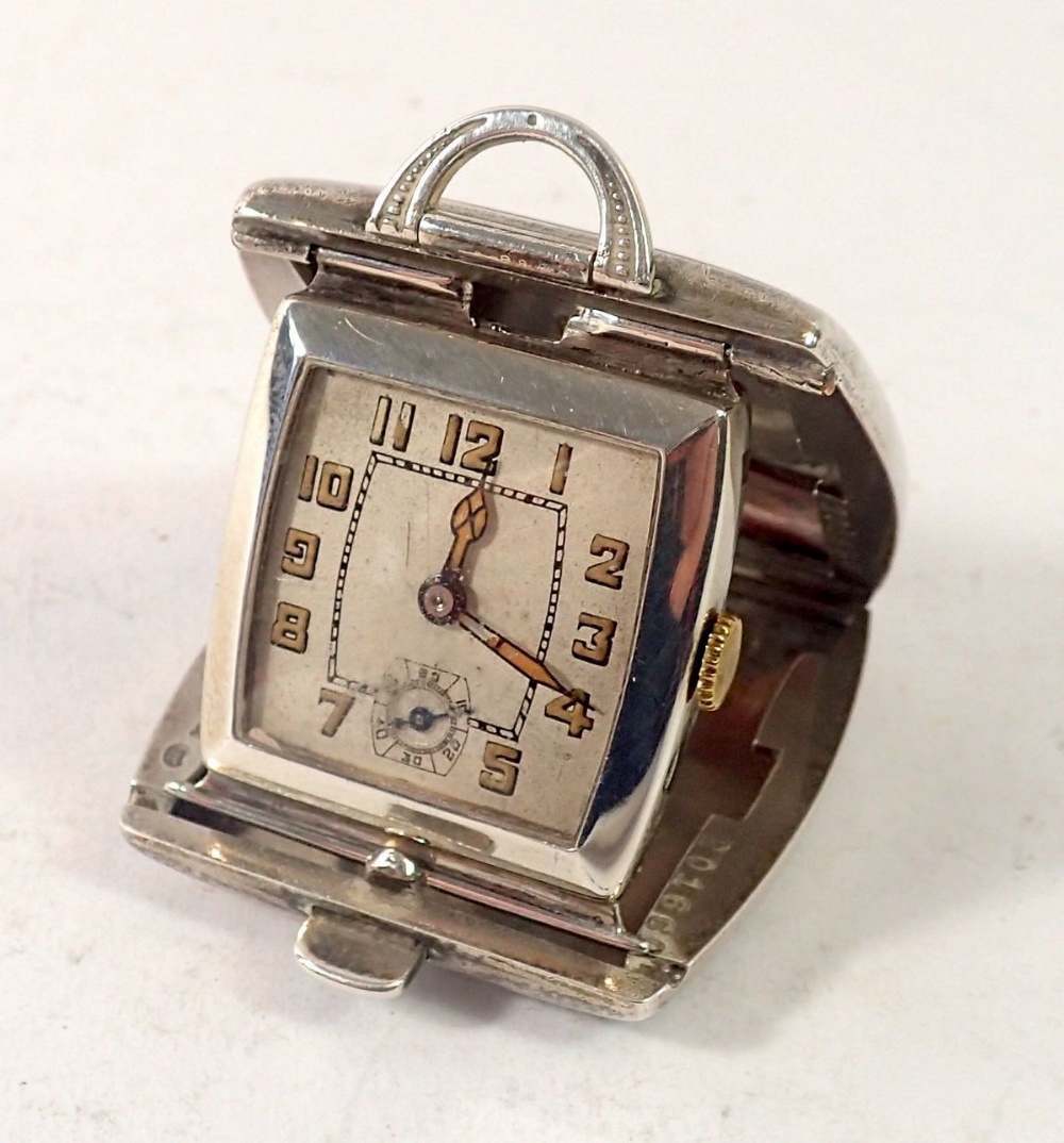 A silver cased watch, 3.5cm wide