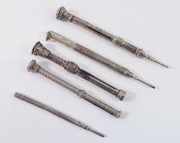 Five various white metal extending pencils including an Aspreys one and three stone set examples