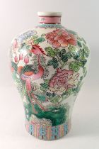 A 20th century Chinese vase painted exotic birds and flowers, 30cm tall