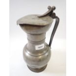 A large 18th century pewter flagon dated 1758 with touchmarks, 30cm tall
