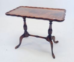 A walnut occasional table on twin supports, 59 x 34cm