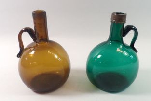 Two antique glass shaft and globe bottles in green and brown, 18.5cm tall