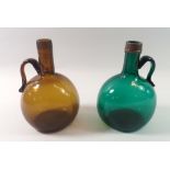 Two antique glass shaft and globe bottles in green and brown, 18.5cm tall
