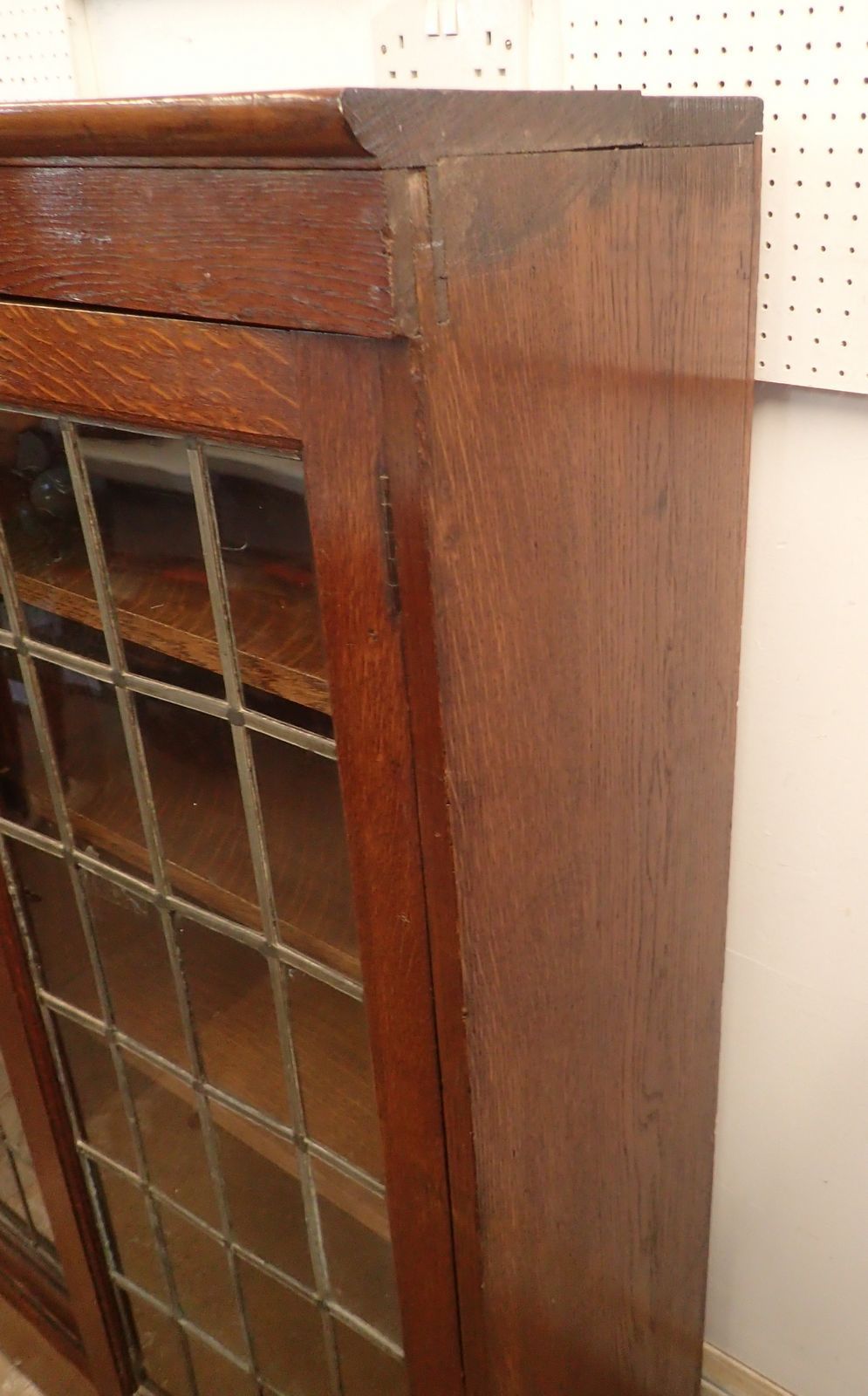 An early 20th century oak lead glazed dwarf bookcase with three doors enclosing shelves, 156cm - Image 5 of 5