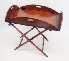 A Georgian mahogany butlers tray on turned wood stand