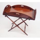 A Georgian mahogany butlers tray on turned wood stand